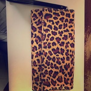 Satin animal print clutch w/ removable wristband.
